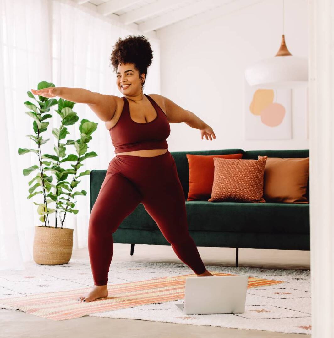 Healthy woman doing yoga at home weight-loss-injections